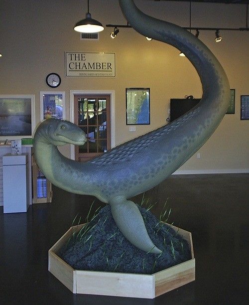 Life-sized sculpture of the Altamaha-ha creature — a long-necked, serpentine animal — on display inside the McIntosh County Chamber of Commerce